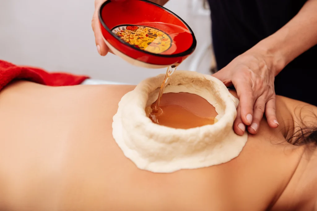 Kerala Ayurveda clinic therapy with traditional herbal oil treatment