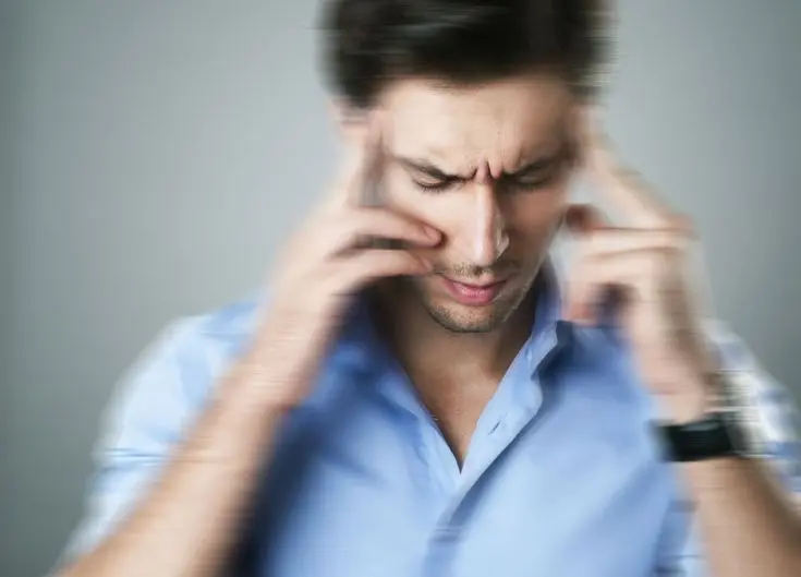 Man experiencing dizziness and vertigo symptoms seeking natural Ayurvedic treatment