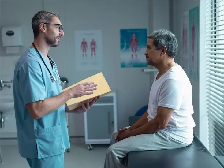 Doctor consulting a patient about triglycerides treatment and heart health through Ayurveda